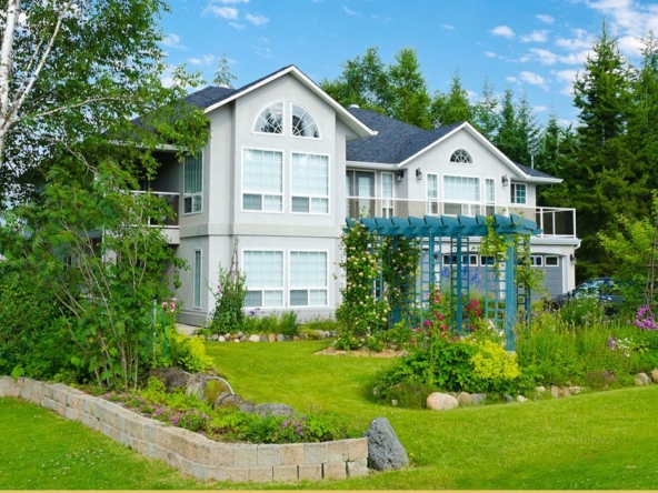 large modern home in wooded area